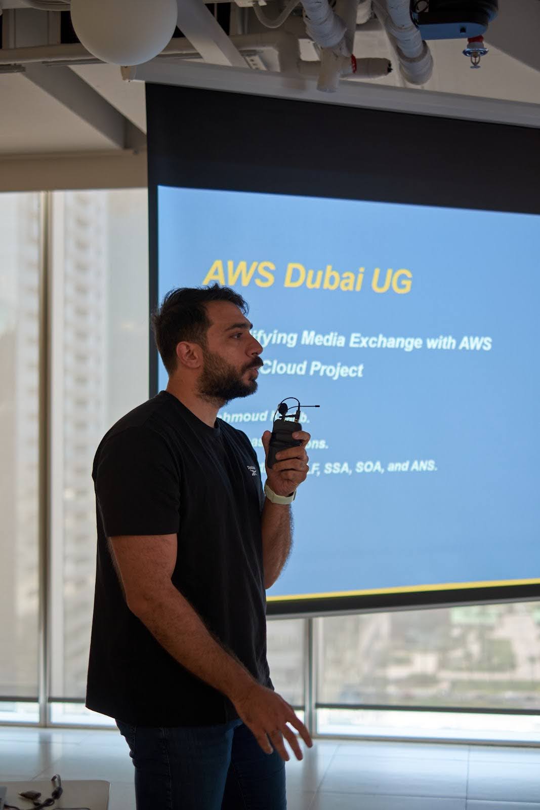 A photo of a speaker at the AWS user meetup held in the Deriv Dubai office.